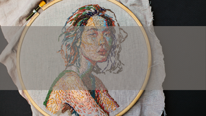 Embroidered image of woman in an embroidery hoop
